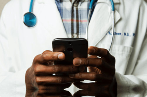 medical employee using a smartphone